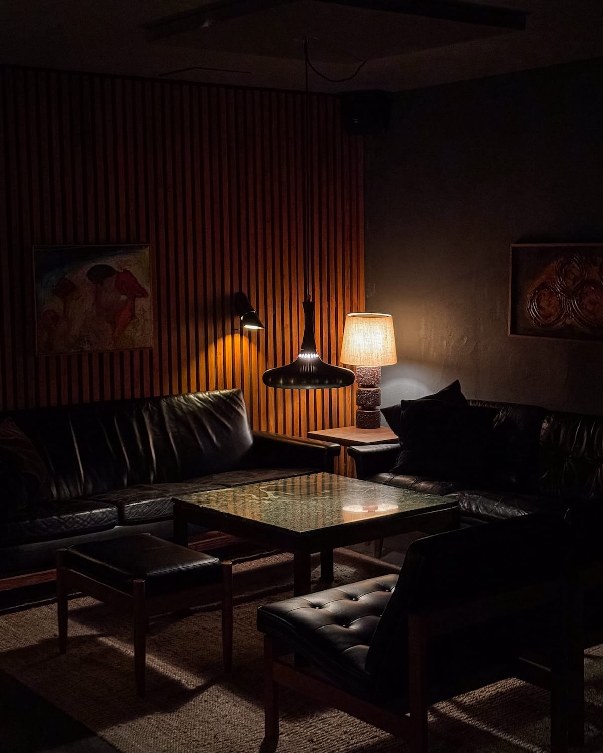 Vintage Scandi furniture in a dimly lit space at Duck & Cover